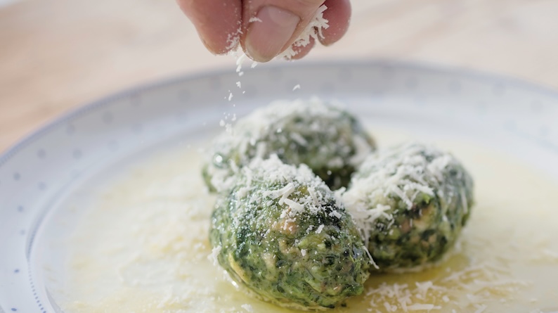 Cheese being sprinkled over a dish in Val Gardena, Italy.