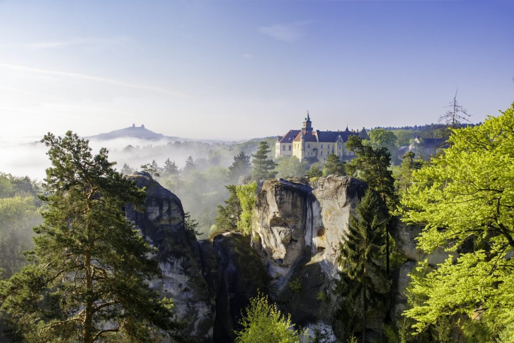 Cliffs in Bohemian Paradise with castle in background (Photo credit: Václav Bacovský)